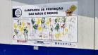 Painel da Campanha da Proteção das Mãos e Dedos que visa alertar sobre os cuidados e a utilização de luvas nas atividades nas obras da Ponte de Guaratuba